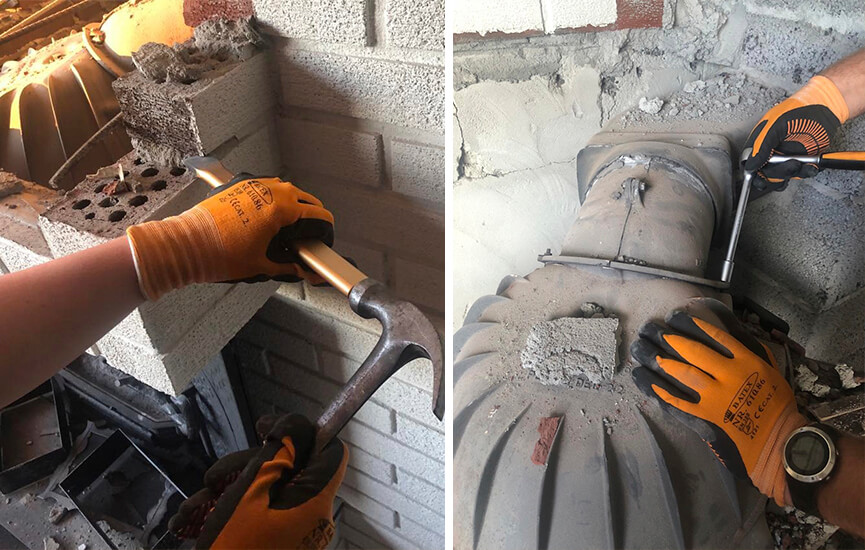 Hænder river gammel pejs ned